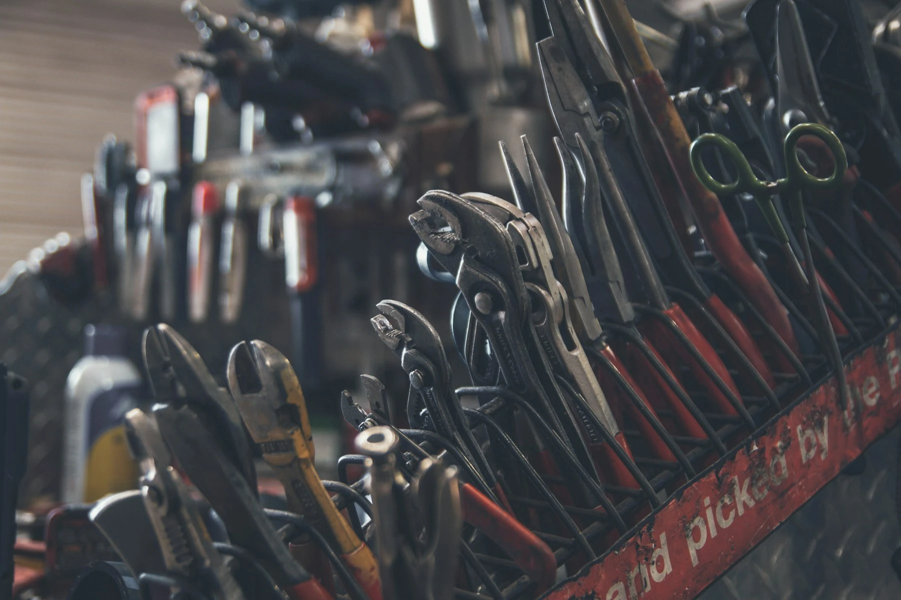 Hand tools laid out on a bench